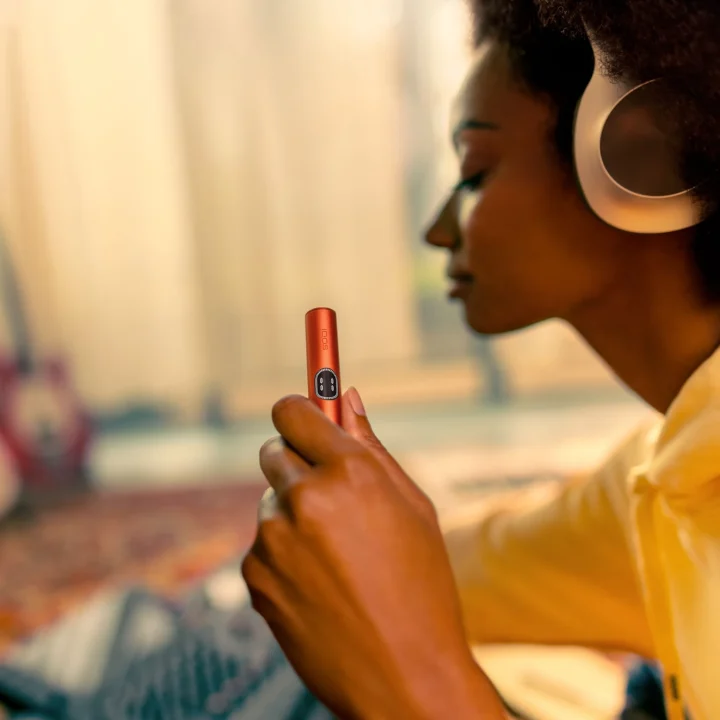 Latest IQOS ILUMA i device with induction-heating technology for smoke-free tobacco.