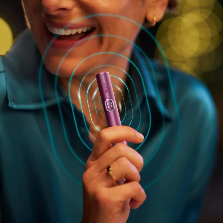 Latest IQOS ILUMA i device with induction-heating technology for smoke-free tobacco.