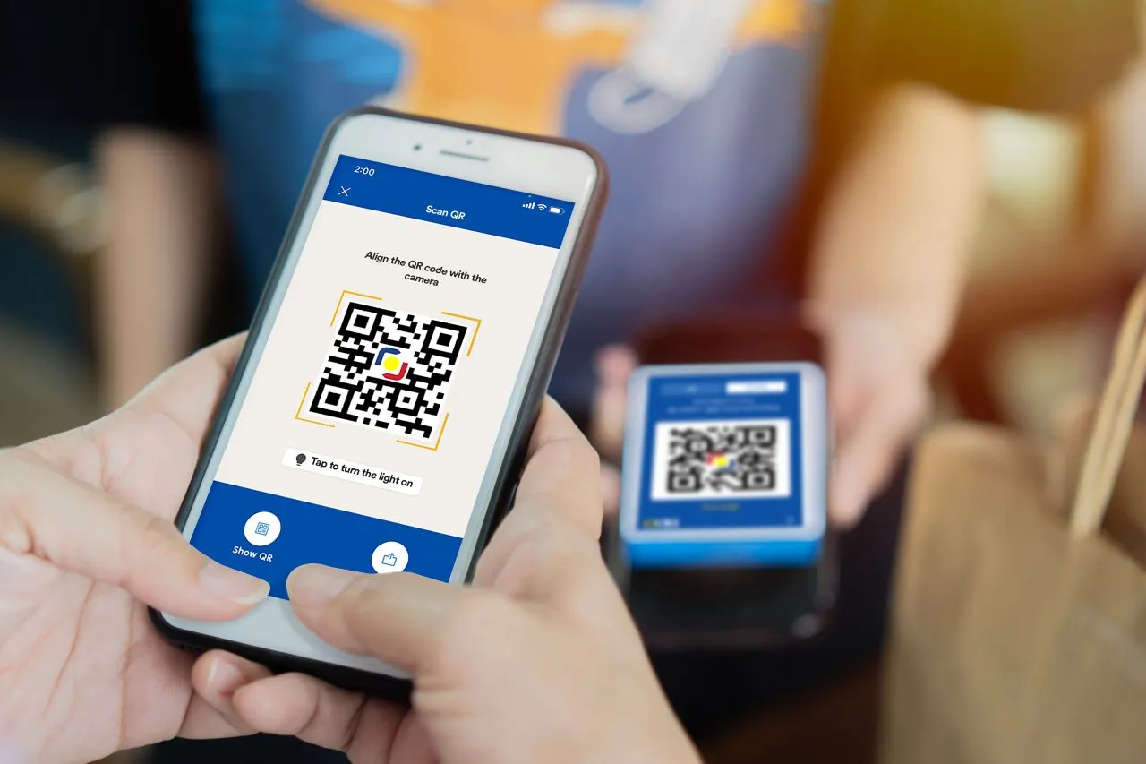 Smartphone displaying BDO Pay app interface for cashless holiday shopping