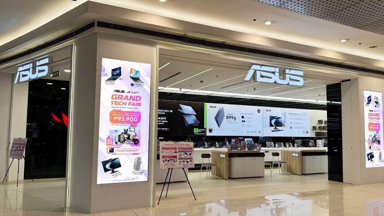ASUS flagship store interior with laptops and gaming displays