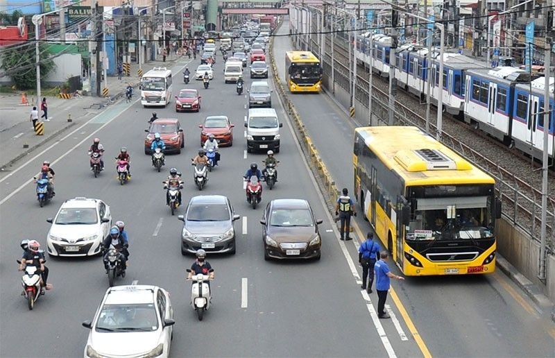 Passenger scanning QR code to pay EDSA Busway fare